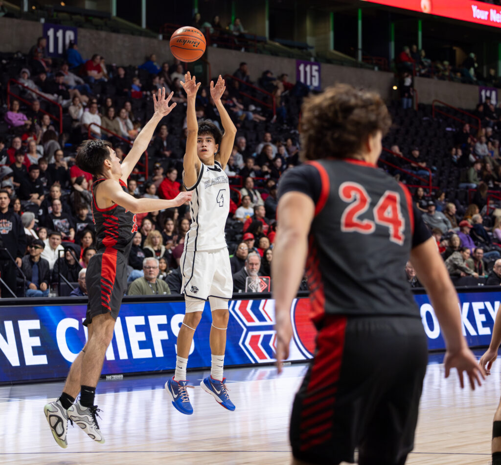 Lummi sophomore guard Dyson Edwards shoots a 3-pointer March 7 to put the Blackhawks up three points in the fourth quarter. Lummi beat Neah Bay 49-45 to advance to the 1B state title game March 8.