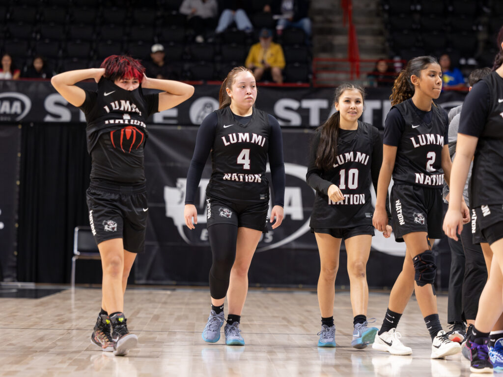 Lummi Nation girls basketball walks off the court March 5 after being eliminated, 51-47, by Pateros in the Round of 12 of the 1B state basketball tournament at the Spokane Arena.