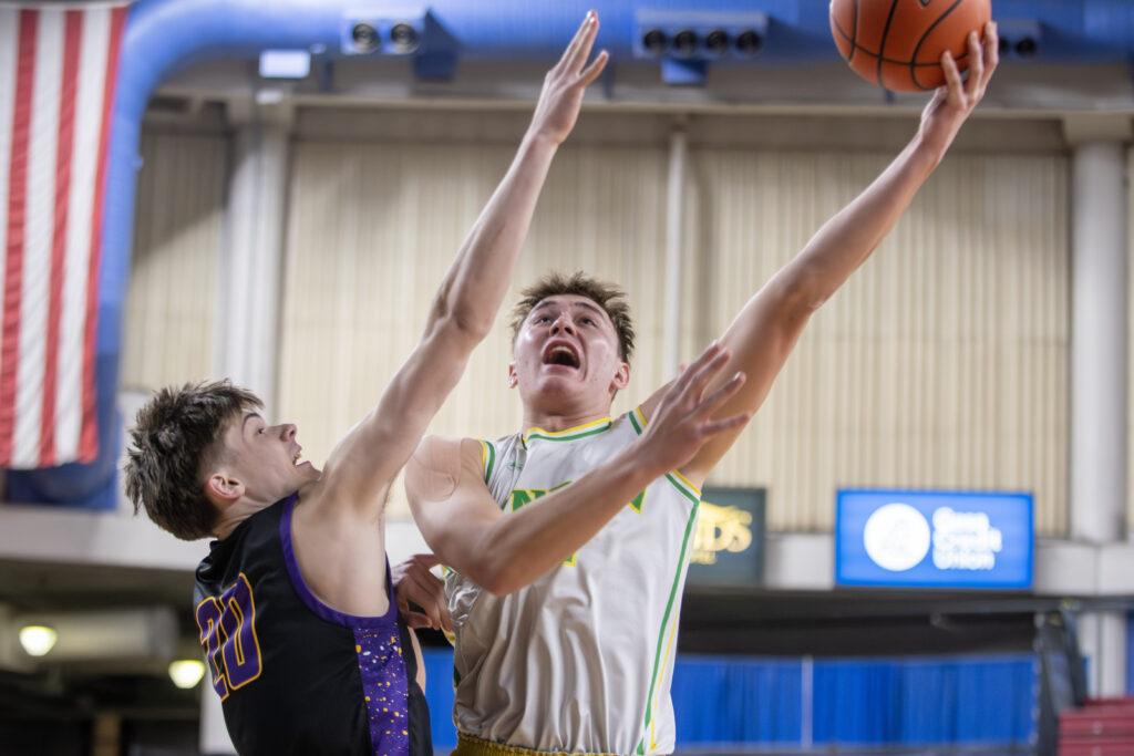 Lynden senior Brant Heppner goes up for a lay-in against Columbia River's Luca Phillips.