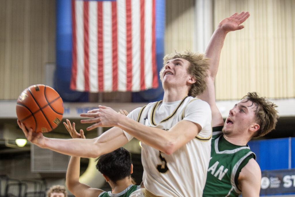 Meridian senior Jaeger Fyfe drives to the bucket for two points.