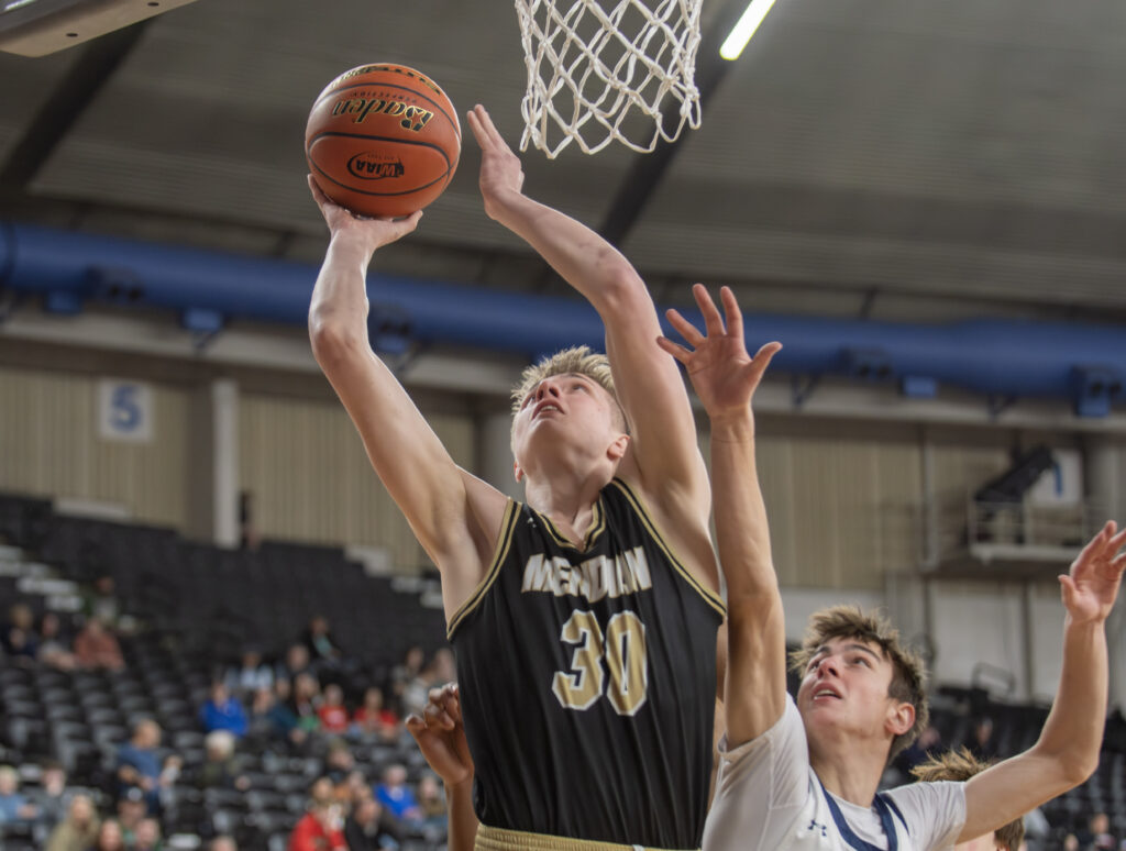 Meridian senior post James Hedahl goes up for a bucket in the paint.