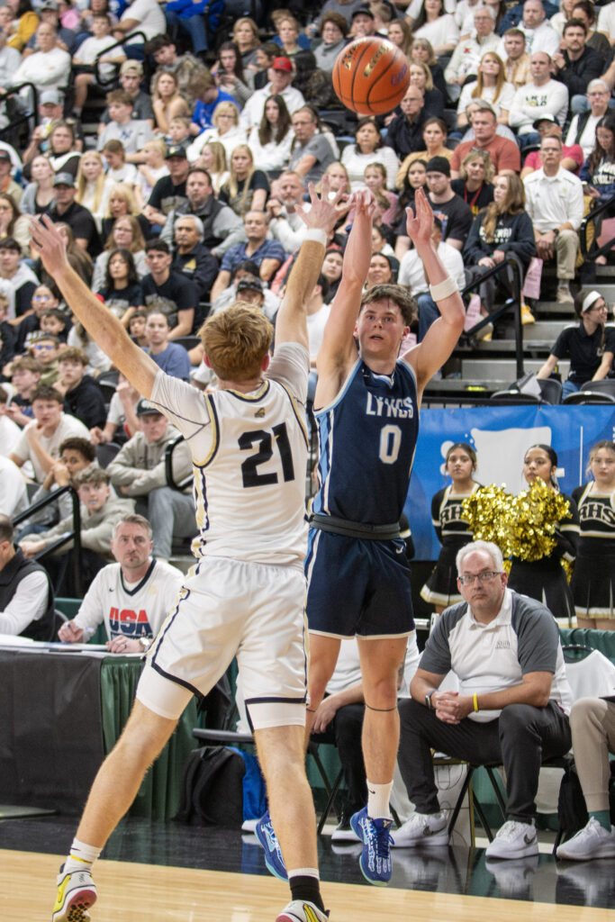 Lynden Christian sophomore Dawson Hintz let a 3-pointer rip over a Royal defender.