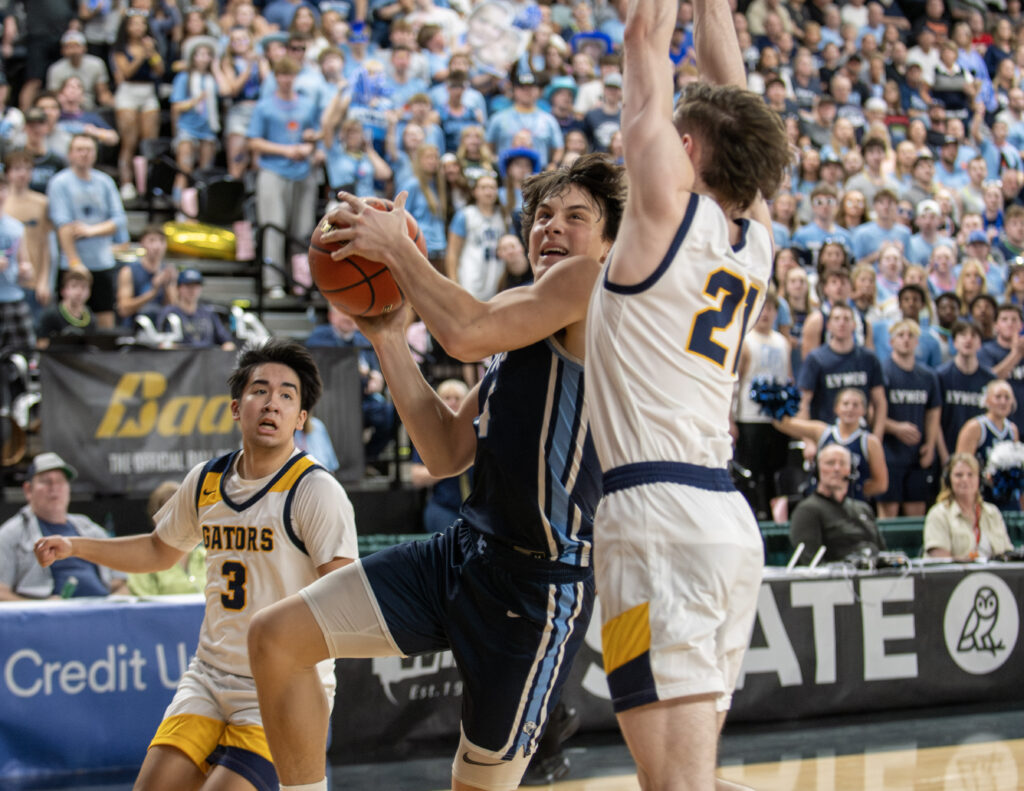 Lynden Christian junior Boyce Robertson drives to the bucket.