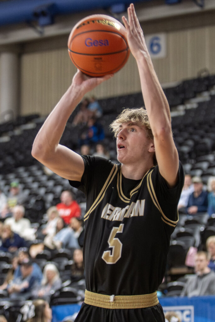 Meridian senior Jaeger Fyfe takes a wide-open corner 3-pointer.