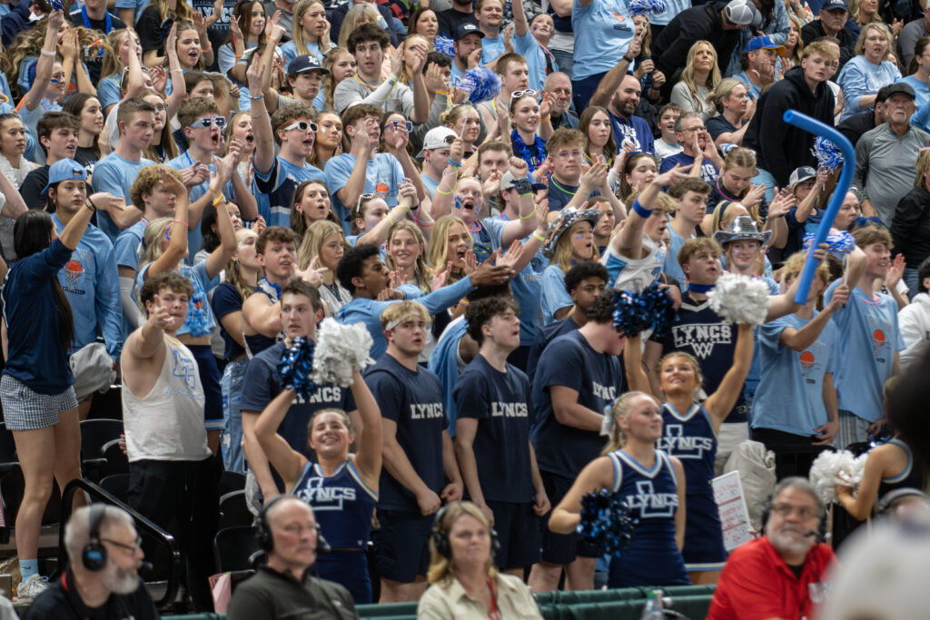 Lynden Christian's student section cheers after the Lyncs make a basket against Annie Wright.