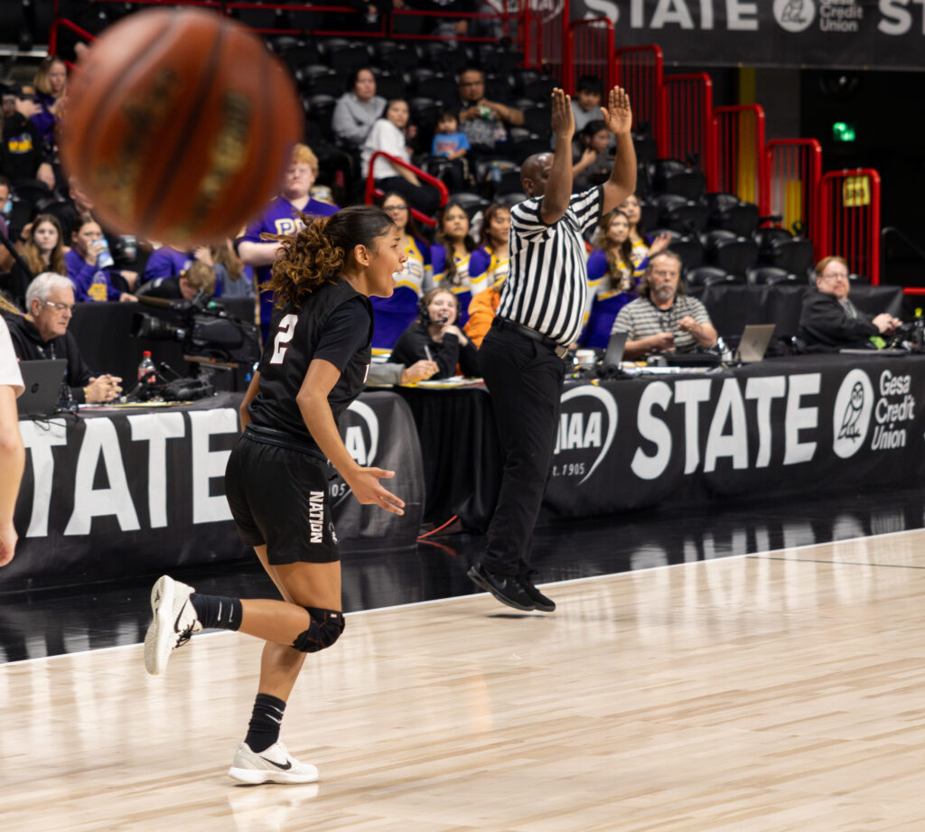 Junior guard Ailina Rabang celebrates hitting a 3-pointer.