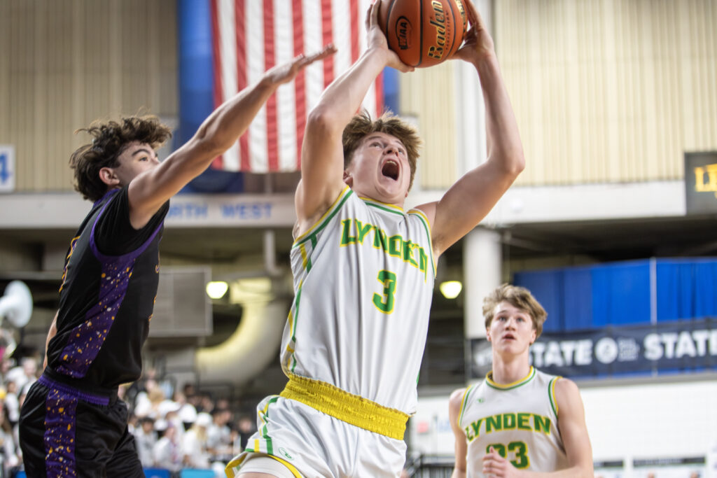 Lynden sophomore Gordy Bedlington gets past a Columbia River defender on the way to the hoop.