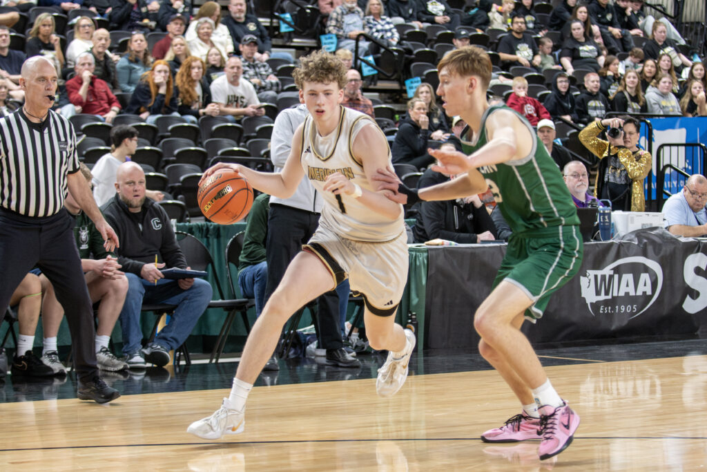 Meridian senior Talon Jenkins drives around a Chelan defender.