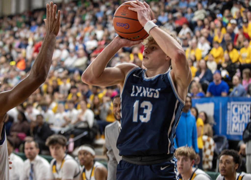 Lynden Christian senior Gannon Dykstra lines up a corner 3-pointer.