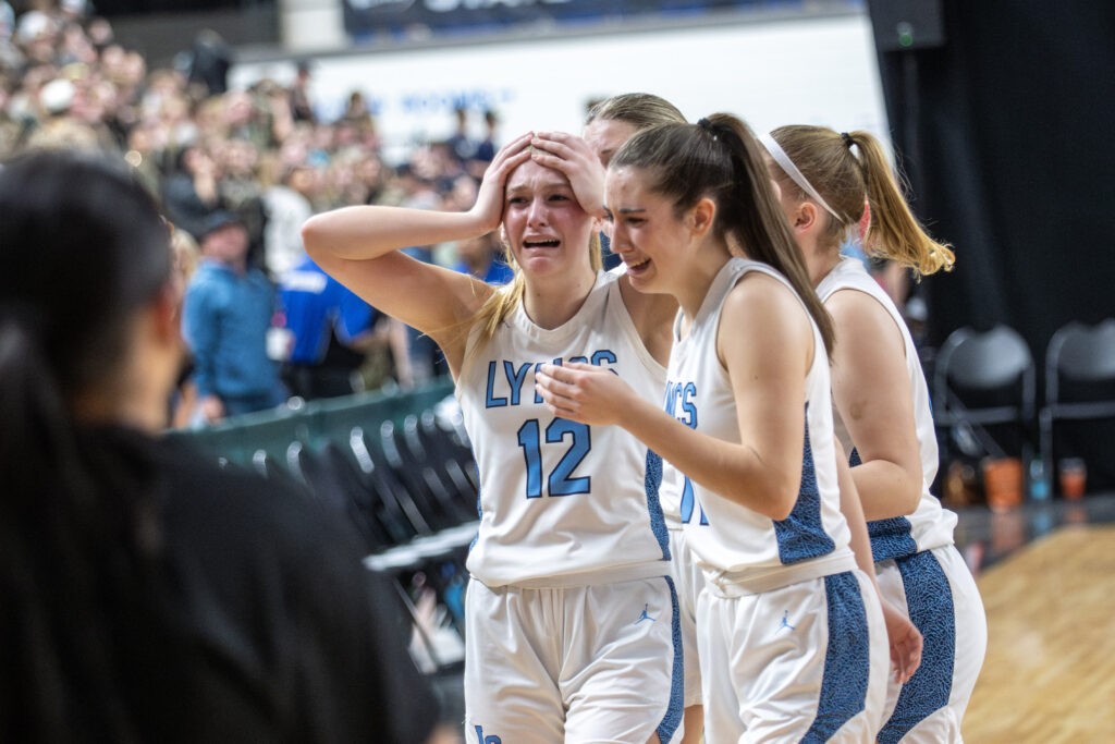 Lynden Christian's Ella Fritts holds her head in disbelief March 7 after losing to King's on a buzzer-beater in the 1A state semifinals at the Yakima Valley SunDome.