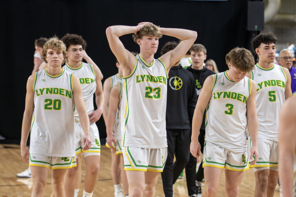 Top-seeded and three-time defending state champion Lynden walks off the court March 7 after getting upset and eliminated, 41-38, by No. 11 Columbia River in a 2A state consolation match at the Yakima Valley SunDome.