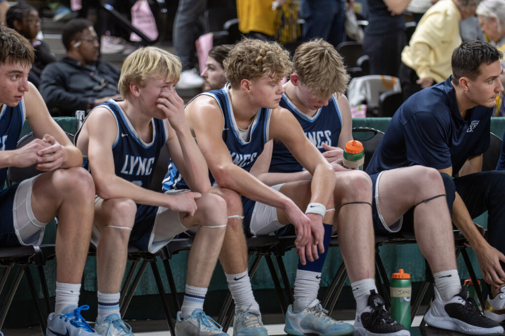 Lynden Christian starters are emotional on the bench March 8 after coming out in the final seconds of a 59-46 loss to Annie Wright in the 1A state championship at the Yakima Valley SunDome.