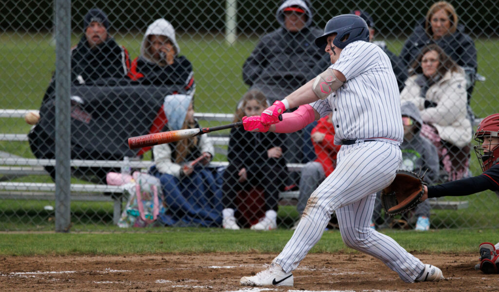 Lynden Christian’s Trey Johnson drives in a three-run triple March 20 during the Lyncs' 11-1 victory in five innings over Mount Baker at home.