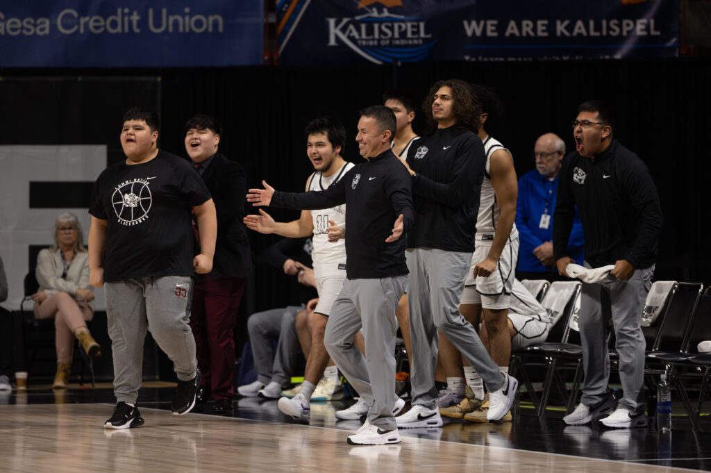 Lummi Nation's bench heads to the court duing a timeout after a hot start.