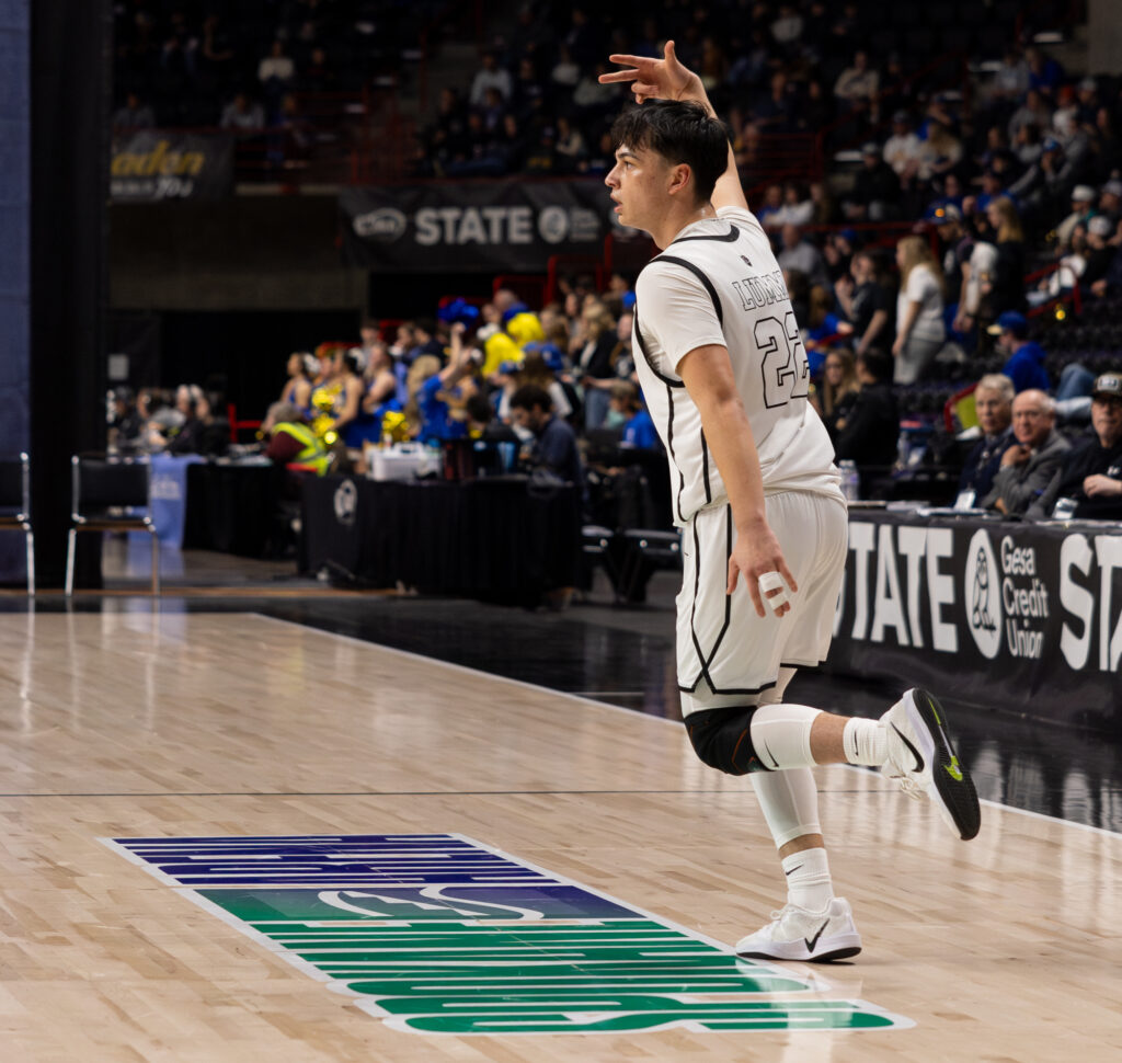 Senior guard Karson Revey celebrates a 3-pointer.