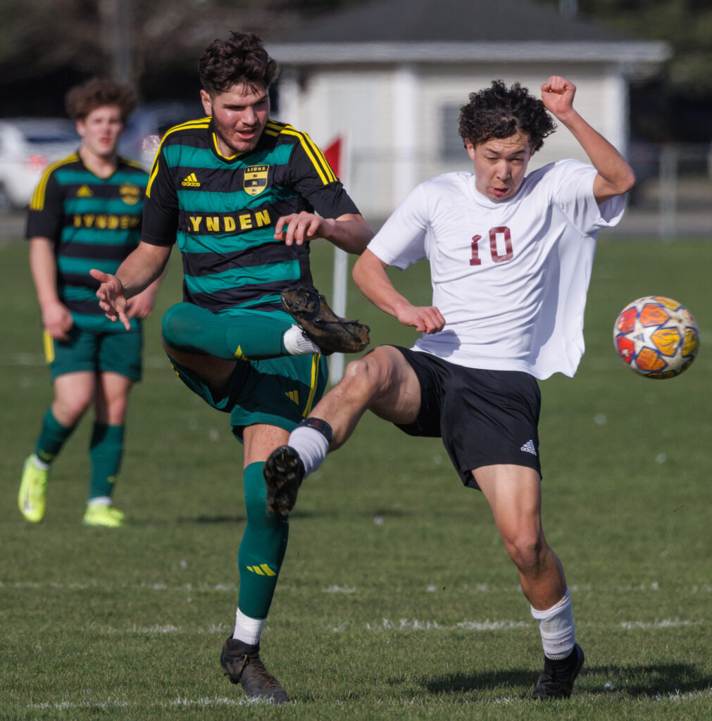 Lynden’s Tatius Robinson kicks the ball past a Lakewood defender.