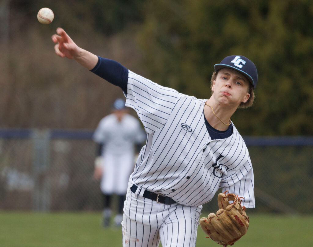 Lynden Christian’s Jaxon Huleatt unleashes a pitch. Huleatt fanned eight batters in five innings.