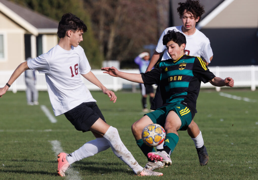 Lynden’s Irwin Polanco beats a Lakewood player to the ball.