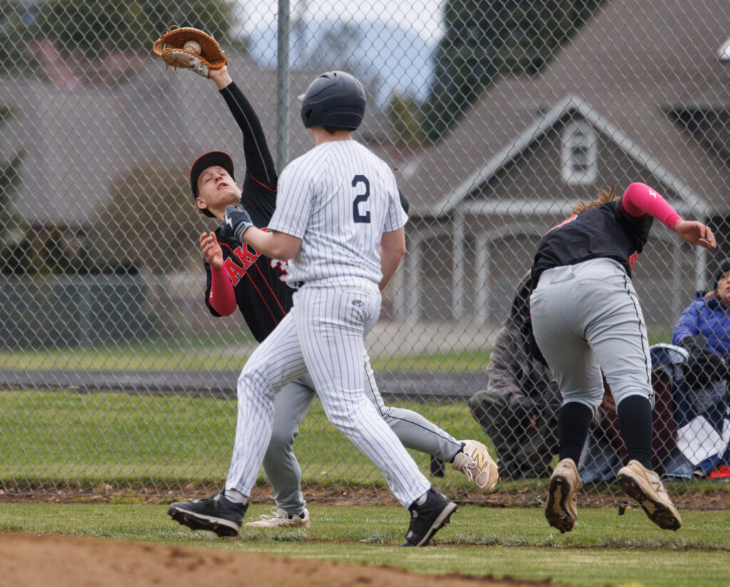 Avoiding a collision, Mount Baker’s Carson Worimer makes the catch.